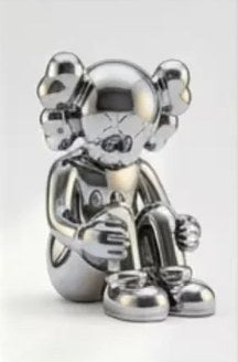 Seated chrome toy figure sculpture art print in a custom frame for a boys bedroom