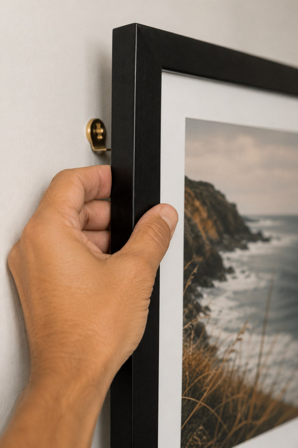 professional installation of a framed print on a wall, Johannesburg wall décor service