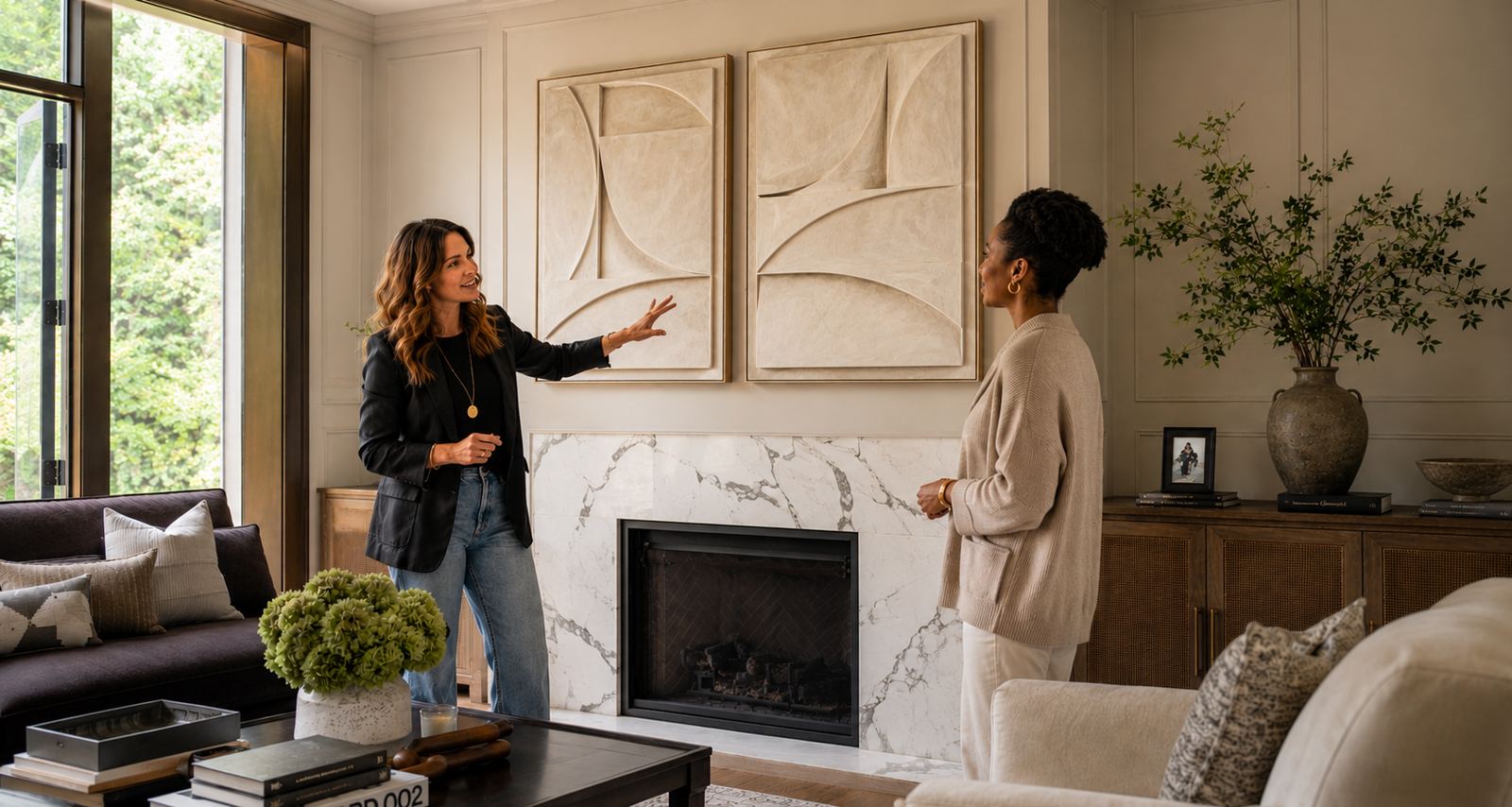 wall décor consultant discussing framed artwork with a client in a Johannesburg home