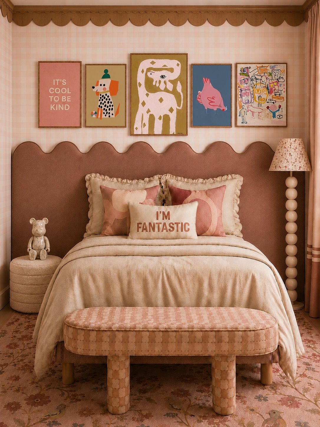 Children's bedroom with a framed gallery wall above a scalloped bed